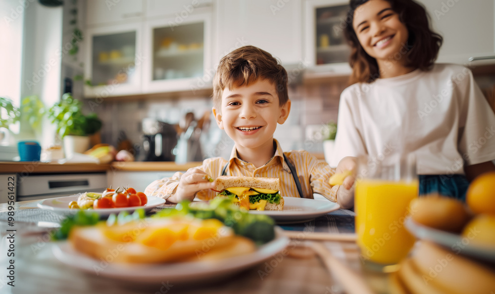 cheerful young boy enjoys healthy breakfast in bright modern kitchen with smiling mother. scene is filled with fresh fruits and vegetables. Warm moment perfect for promoting nutrition and family meals cheerful young boy enjoys healthy breakfast in bright modern kitchen with smiling mother. scene is filled with fresh fruits and vegetables. Warm moment perfect for promoting nutrition and family meals