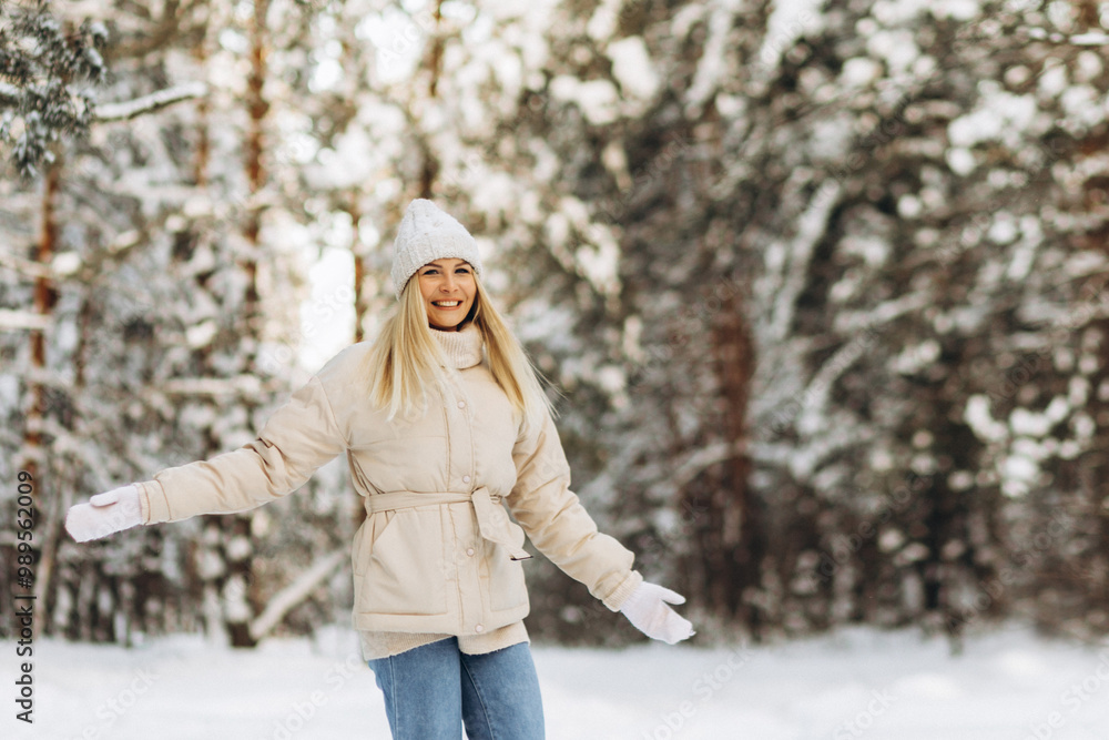 Winter portrait of a joyful young woman in a snowy forest. Vacation, tourism, simple life. Winter portrait of a joyful young woman in a snowy forest. Vacation, tourism, simple life.