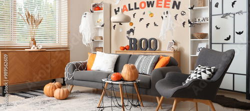 Interior of stylish living room decorated for Halloween photo