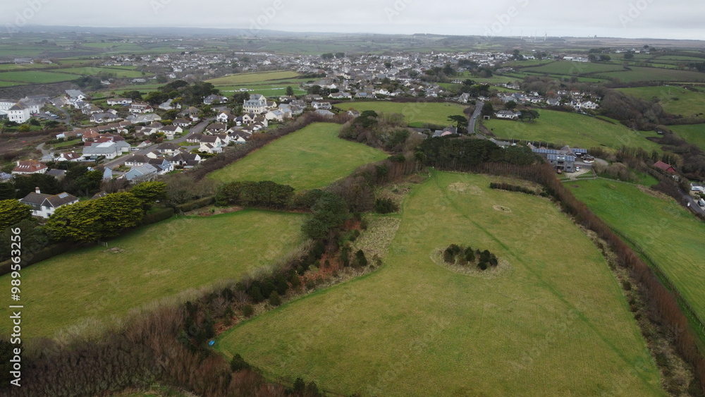 Aerial view of small town and surrounding green fields Aerial view of small town and surrounding green fields