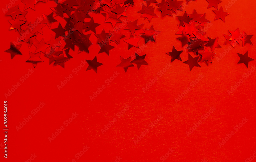 Red Star Confetti on Red background. Greeting Card for Christmas, New Year and Birthday with Copy space. Red Star Confetti on Red background. Greeting Card for Christmas, New Year and Birthday with Copy space.