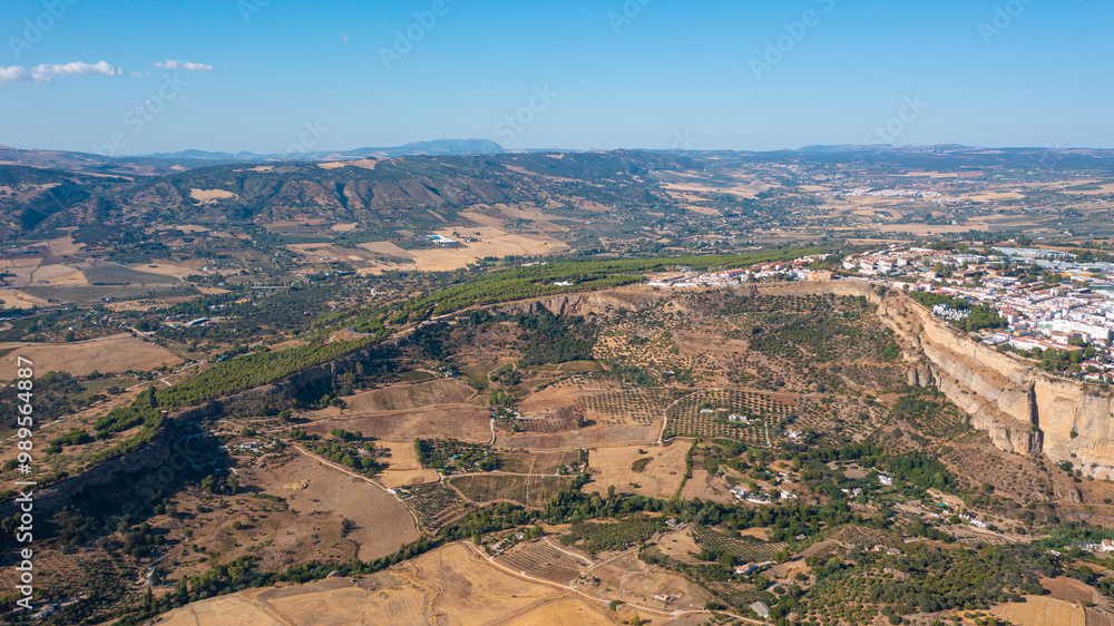 Aerial photo from drone to Puente Nuevo (The New Bridge) over Guadalevin River in Ronda medieval town sunset. Ronda, Andalusia, Spain. Aerial photo from drone to Puente Nuevo (The New Bridge) over Guadalevin River in Ronda medieval town sunset. Ronda, Andalusia, Spain.