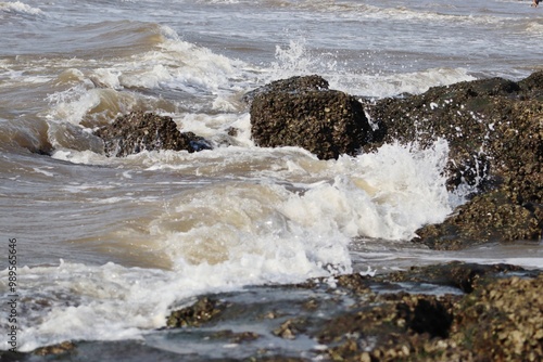 Big sea waves hitting the stones