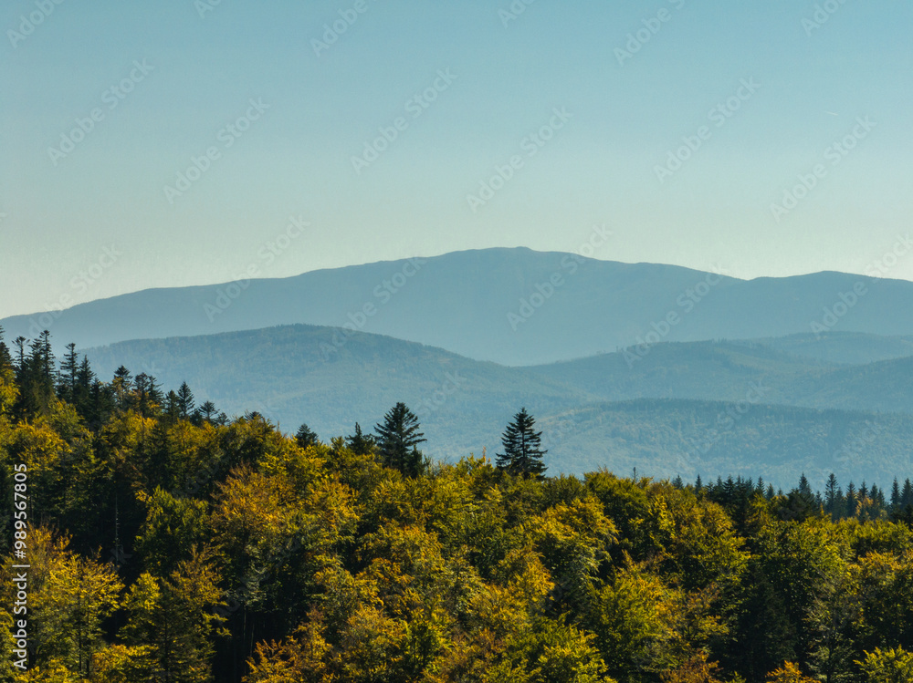 Fototapeta premium Beskid Maly aerial panorama of potrojna hill and czarny gron.Little Beskids mountain range in summer.Aerial drone view of Rzyki Village in Beskid Maly Poland.Czarny gron ski resort in Rzyki.