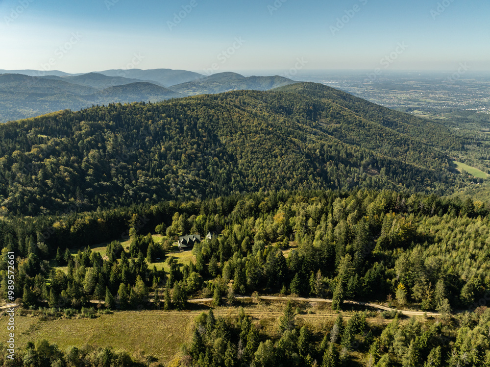 Naklejka premium Beskid Maly aerial panorama of potrojna hill and czarny gron.Little Beskids mountain range in summer.Aerial drone view of Rzyki Village in Beskid Maly Poland.Czarny gron ski resort in Rzyki.