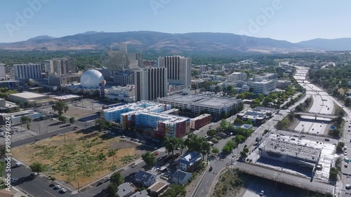 Panoramic aerial view of the city of Reno cityscape in Nevada. Downtown Reno, Nevada, with hotels, casinos and the surrounding High Eastern Sierra foothills.