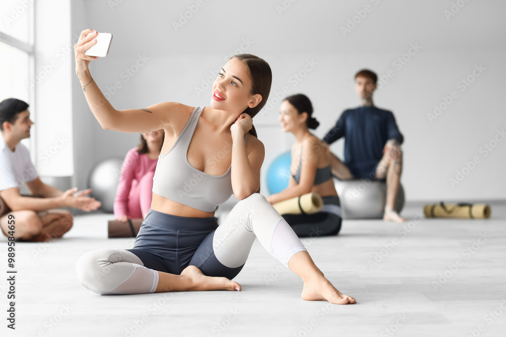 Sporty young woman taking selfie in gym Sporty young woman taking selfie in gym