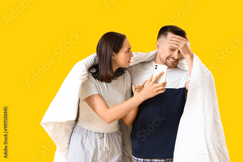 Young couple with mobile ph...