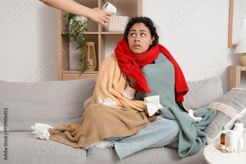 Girl with infrared thermome...