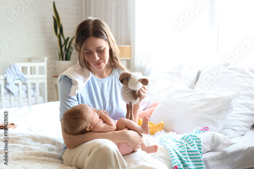 Stressed young mother suffe...