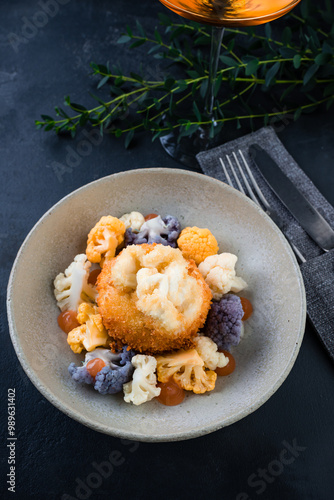 Snack breaded mozzarella cheese ball with cauliflower and sauce. photo