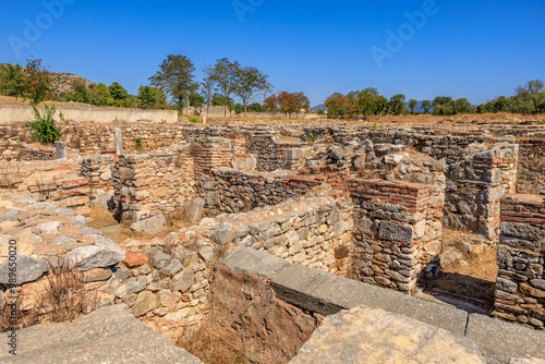 A large, empty courtyard with a blue sky above. Ruins of the ancient city of Philippi, Greece