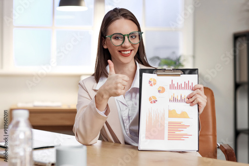 Smiling businesswoman showi...