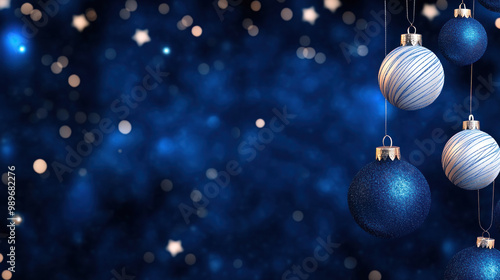 Elegant blue Christmas baubles hang against starry night background.