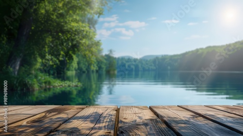 Fototapeta Naklejka Na Ścianę i Meble -  Empty wooden table top with blurred background of lake and forest in summer