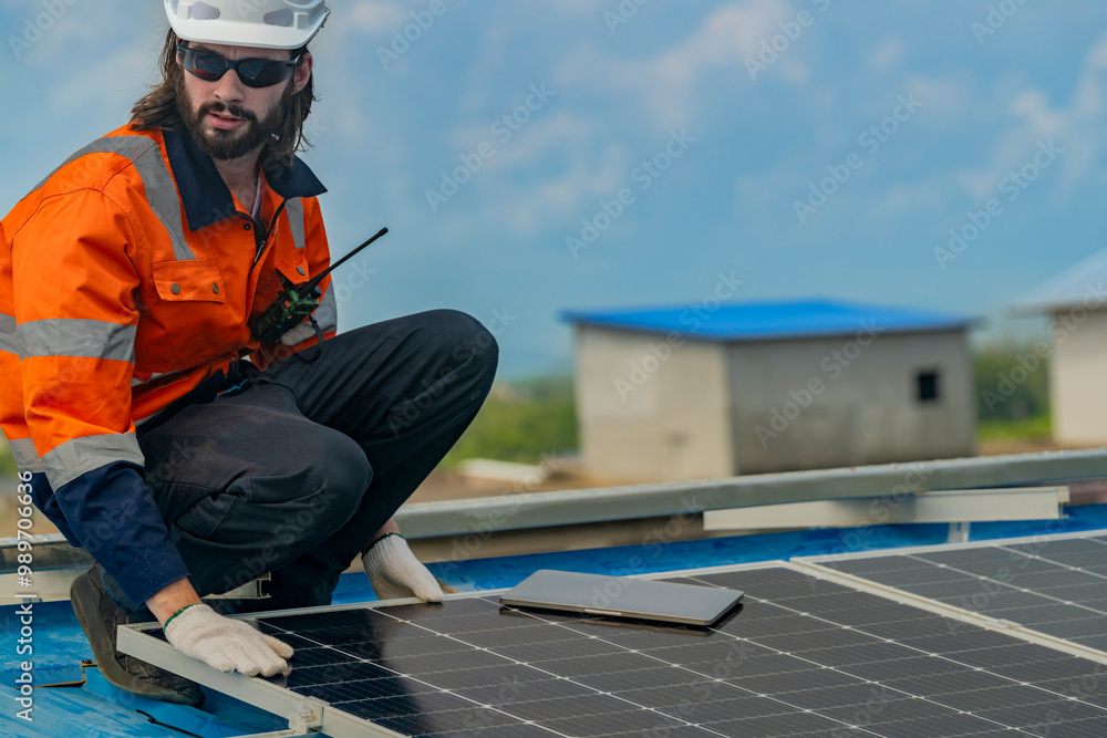 Worker Technicians are working to construct solar panels system on roof. Installing solar photovoltaic panel system. Men technicians walking on roof structure to check photovoltaic solar modules. Worker Technicians are working to construct solar panels system on roof. Installing solar photovoltaic panel system. Men technicians walking on roof structure to check photovoltaic solar modules.