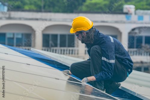 Worker Technicians are working to construct solar panels system on roof. Installing solar photovoltaic panel system. Men technicians walking on roof structure to check photovoltaic solar modules.