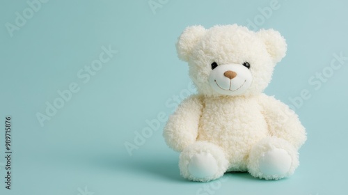 A plush teddy bear with a smiling face is positioned against a serene pastel backdrop, evoking feelings of joy and nostalgia