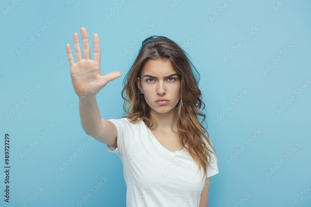 Serene Woman Gesturing Stop with Palm Serene Woman Gesturing Stop with Palm