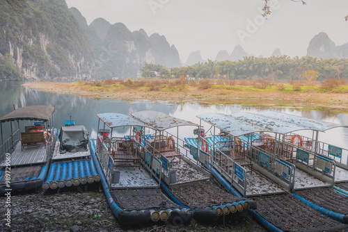 Old Bamboo rafts at the Li river shore in Xingping, Guilin, China. photo