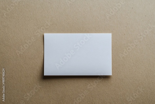 A blank index card on a neutral-colored background, simple