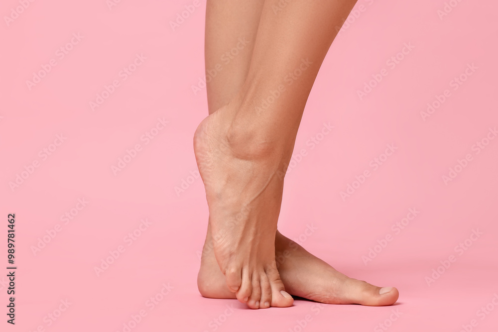 Woman with smooth feet on pink background, closeup. Space for text Woman with smooth feet on pink background, closeup. Space for text