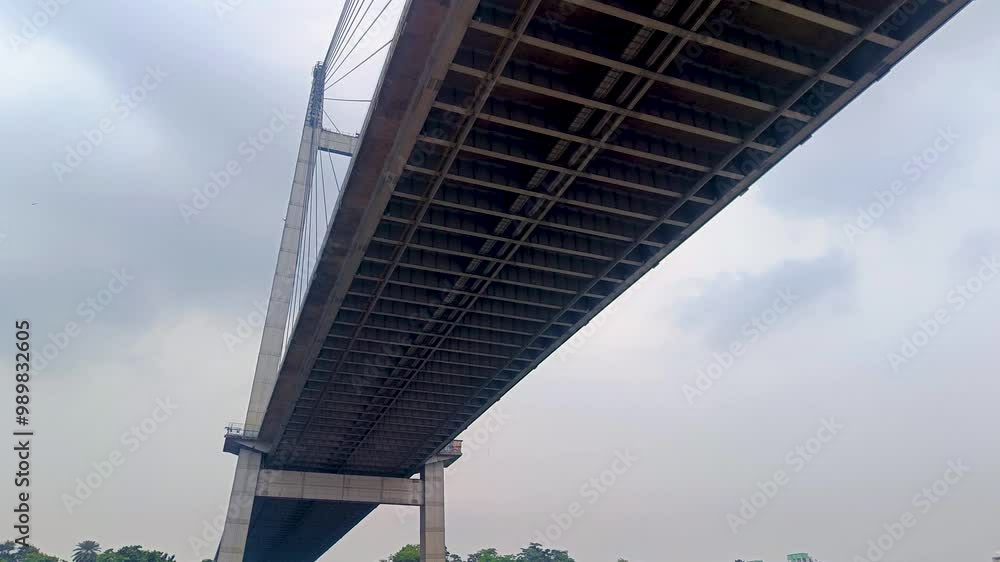 Vidyasagar setu or Vidyasagar bridge of Kolkata city shot from below while moving under it. This bridge is symbolic to metro city Kolkata and west bengal.