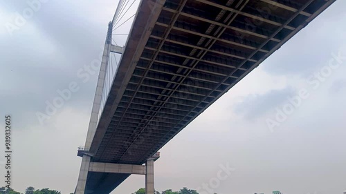 Vidyasagar setu or Vidyasagar bridge of Kolkata city shot from below while moving under it. This bridge is symbolic to metro city Kolkata and west bengal.
