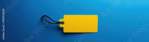 Yellow price tag on blue background, perfect for branding or promotional materials.