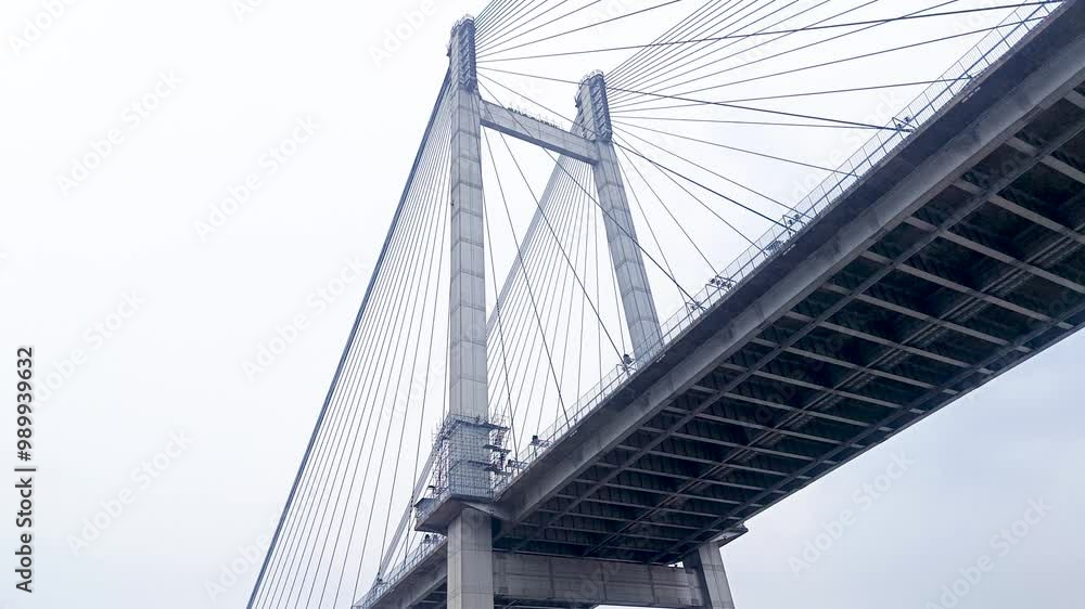 Vidyasagar setu or Vidyasagar bridge of Kolkata city shot from below while moving under it. This bridge is symbolic to metro city Kolkata and west bengal. Vidyasagar setu or Vidyasagar bridge of Kolkata city shot from below while moving under it. This bridge is symbolic to metro city Kolkata and west bengal.