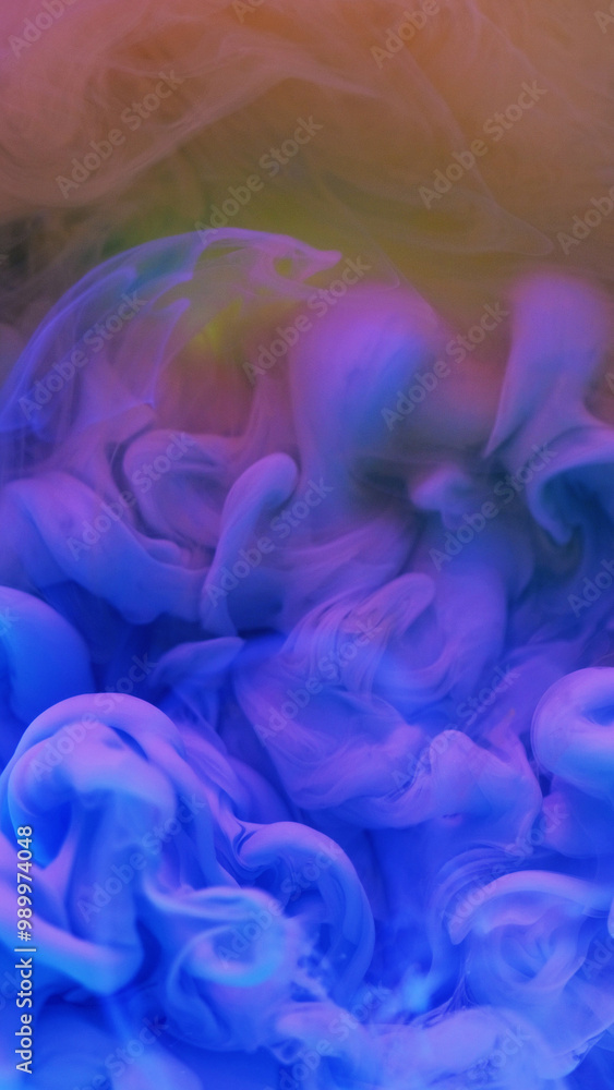 Fototapeta premium Ink drop water. Neon smoke cloud. Defocused blue pink yellow color gradient glowing vapor explosion flow abstract art background.