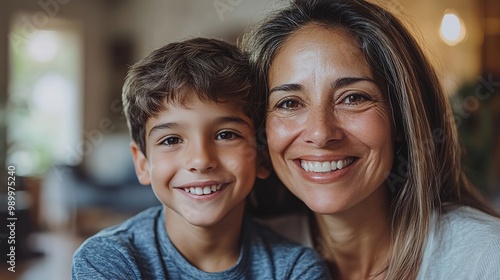 warm and loving moment between a smiling latin mother and her son at home highlighting the affectionate family dynamic and the close emotional bond that brings happiness to their household