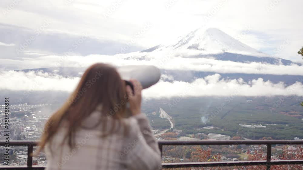 Asian woman enjoy outdoor lifestyle travel Japan on autumn holiday vacation. Attractive girl tourist travel lake Kawaguchi with using binoculars to look beautiful mt Fuji covered in snow on winter Asian woman enjoy outdoor lifestyle travel Japan on autumn holiday vacation. Attractive girl tourist travel lake Kawaguchi with using binoculars to look beautiful mt Fuji covered in snow on winter