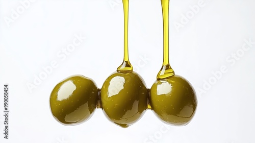 Olive oil dripping on olives on a white background photo