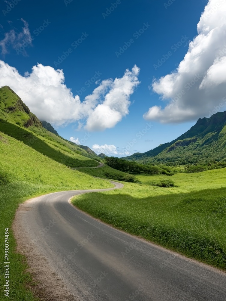 Naklejka premium A scenic winding road snakes through verdant mountains, showcasing the beauty of nature's curves and the allure of an open road. It symbolizes adventure, travel, exploration, freedom, and tranquility.