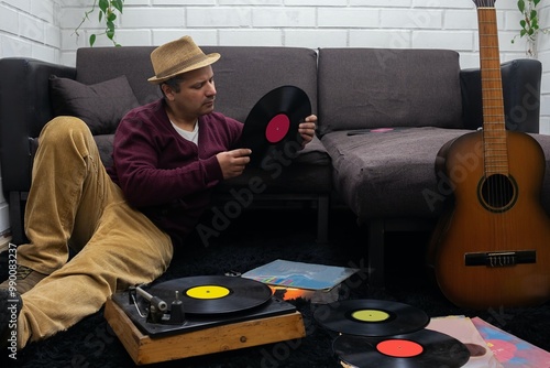 man reviews vinyl records, vintage photography photo