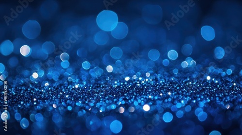 Sapphire glitter bokeh background. Unfocused shimmer royal blue sparkle. Crystal droplets wallpaper