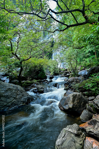 A small waterfall created from water flowing from Khlong Lan Waterfall. In Namtok Khlong Lan National Park Kamphaeng Phet Province