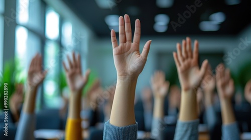 Hands Raised in Classroom.