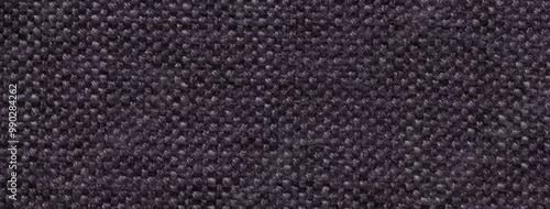 Texture black background from woven textile material with wicker pattern, macro. Structure dark vintage fabric