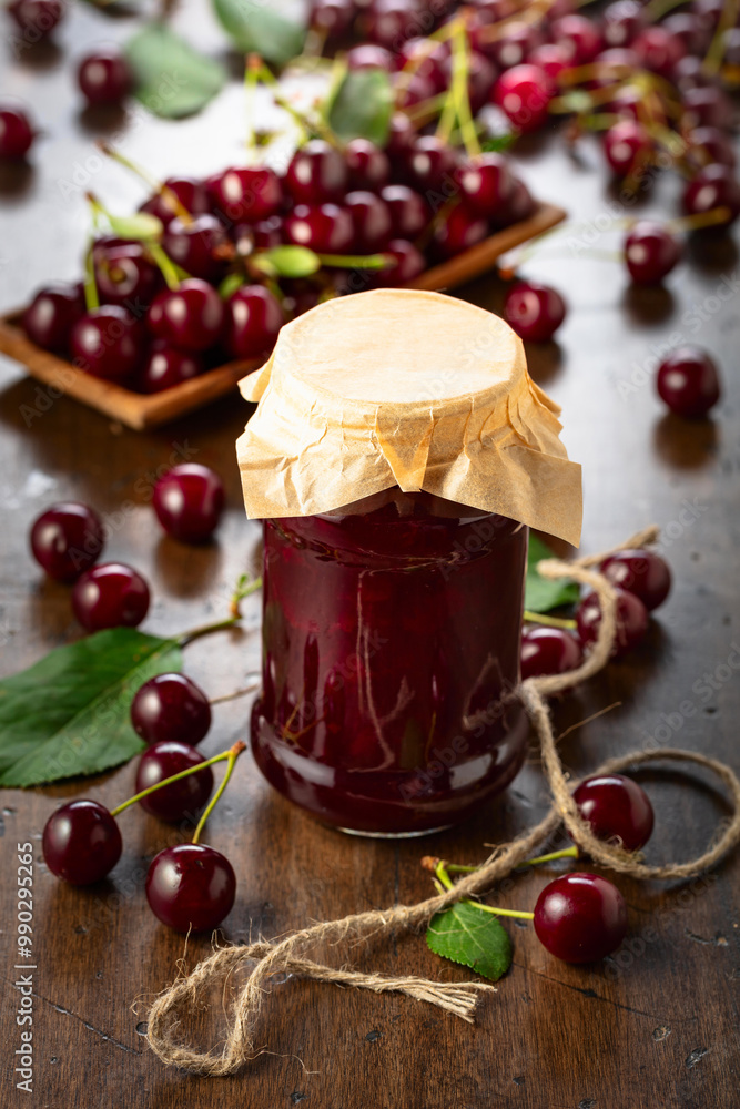 Cherry jam and fresh berries on an old wooden table. Cherry jam and fresh berries on an old wooden table.