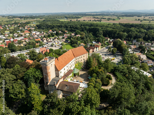 Aerial drone view of castle and Church in Otmochow a town in Nysa County, Opole Voivodeship, Poland. Otmuchow town in summer. Otmuchow panorama from drone aerial fly.. photo