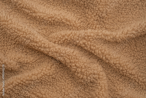 Soft beige fleece fabric with textured surface, ideal for cozy blankets and clothing photo