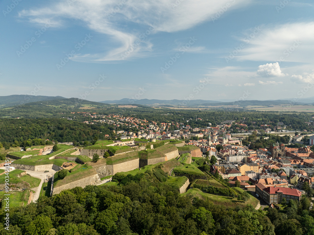 Klodzko Fortress (German: Festung Glatz) – a preserved fortress in Klodzko, a defense system from the 17th and 18th centuries in Poland. Aerial drone view of Klodzko Fortress and town Klodzko.. Klodzko Fortress (German: Festung Glatz) – a preserved fortress in Klodzko, a defense system from the 17th and 18th centuries in Poland. Aerial drone view of Klodzko Fortress and town Klodzko..