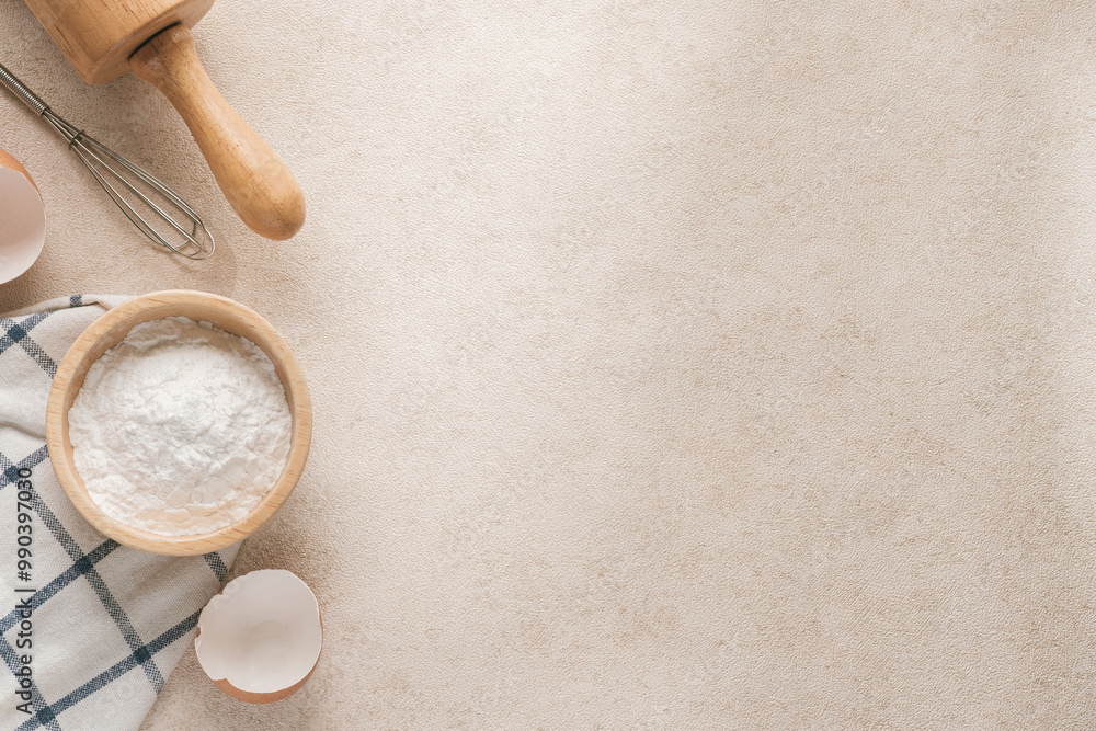 Baking flour and baking supplies placed on a beige tabletop with copy space and horizontal photography. Baking flour and baking supplies placed on a beige tabletop with copy space and horizontal photography.