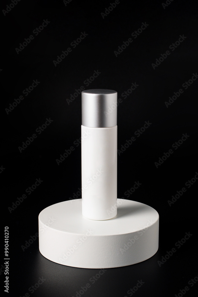Plastic white tube for cream or lotion. Skin care or sunscreen cosmetic with stylish props on black background. Plastic white tube for cream or lotion. Skin care or sunscreen cosmetic with stylish props on black background.