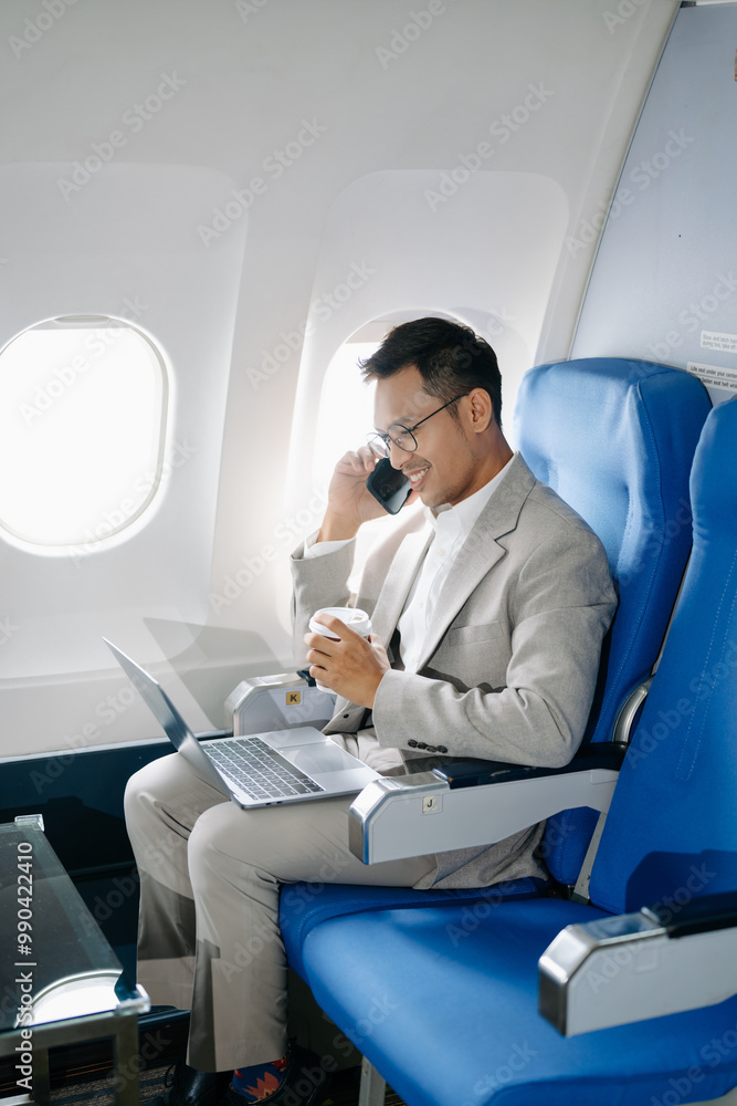 Asian man sitting in a seat in airplane and looking out the window going on a trip vacation travel concept. Asian man sitting in a seat in airplane and looking out the window going on a trip vacation travel concept.