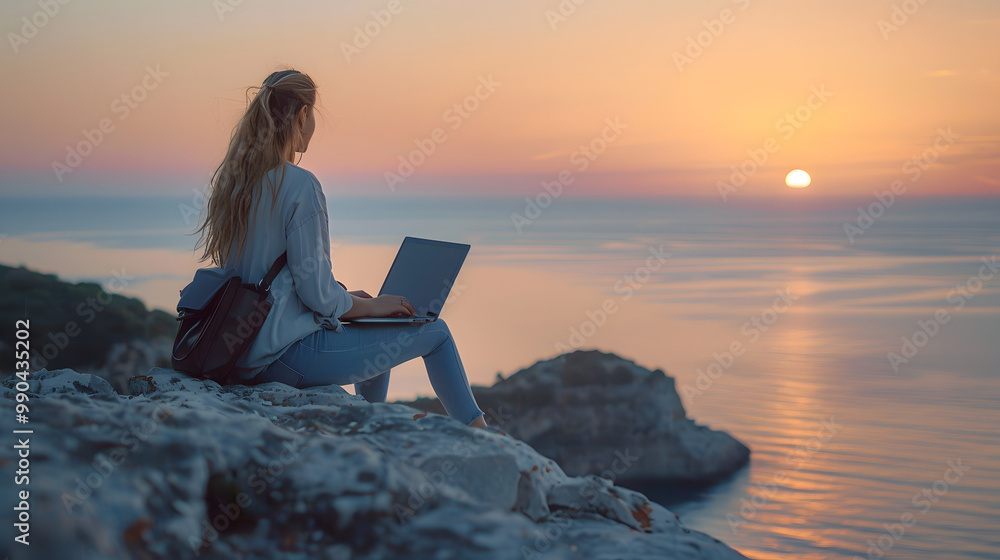 Young business woman working at the computer in cafe on the rock. Young girl downshifter working at a laptop at sunset or sunrise on the top of the mountain to the sea, working Young business woman working at the computer in cafe on the rock. Young girl downshifter working at a laptop at sunset or sunrise on the top of the mountain to the sea, working