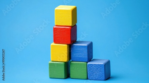 building blocks stacking higher and higher, symbolizing the gradual amassing of progress or achievements