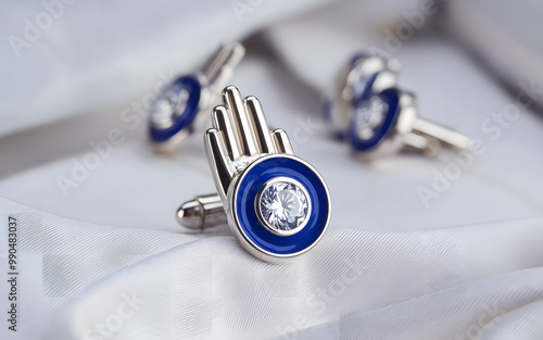 Blank round gold and blue color cufflinks toggle mockup lying, isolated, 3d rendering. Empty clasp golden and steel cuff-link mock up, side view.  photo